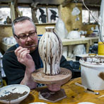 Richard Heeley at work in his pottery in Shropshire Feb 2018